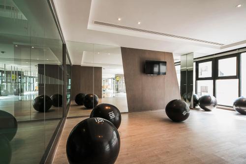 a room with black balls on the floor at Many Holiday The Base Condo in Pattaya