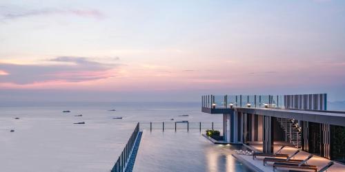 a view of the ocean from a building at Many Holiday The Base Condo in Pattaya Central