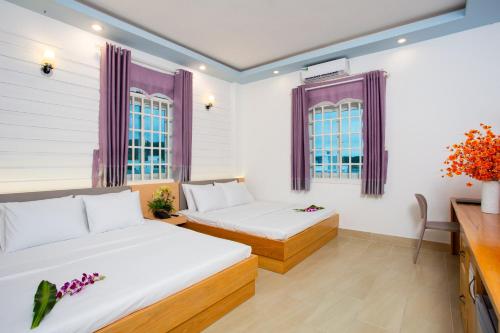 Postel nebo postele na pokoji v ubytování Gold Stars Hotel