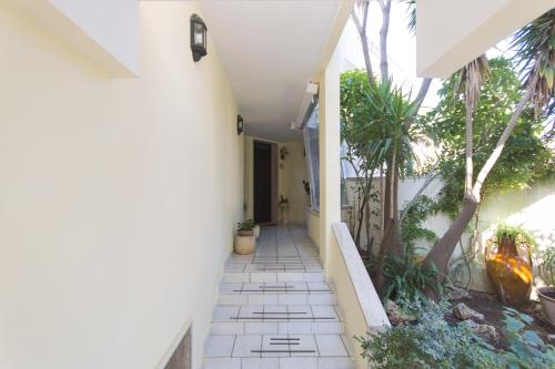 a hallway of a house with palm trees at B&B Luxury in Lecce
