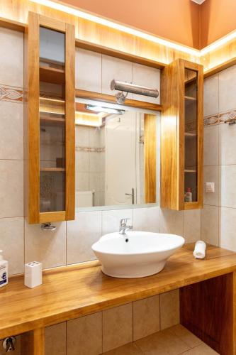 a bathroom with a sink and a mirror at K Ardamis Estate in Kastoria