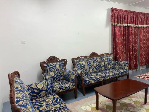 Et opholdsområde på Homestay Sri KS