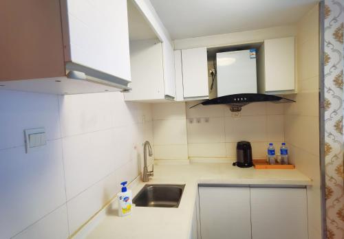 Køkken eller tekøkken på Guangzhou Victory Apartment