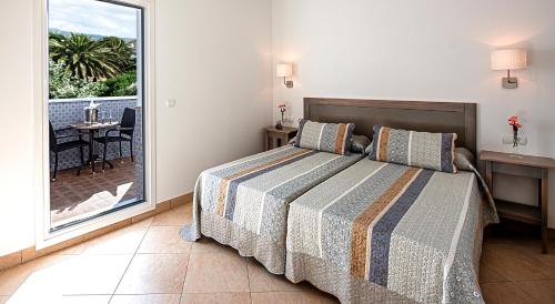 Posteľ alebo postele v izbe v ubytovaní Hostal Tarifa -Recepcion abierta las 24h-