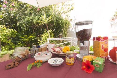 a table with food and a blender on top of it at B&B Luxury in Lecce