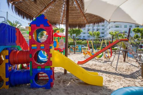 a playground with a slide in the sand at Grand Hotel Don Juan in Giulianova