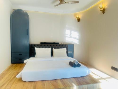 En eller flere senge i et værelse på Roys Villa Havelock