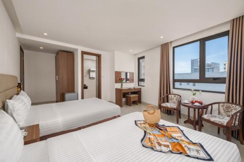 Postel nebo postele na pokoji v ubytování Lumina Hotel & Apartment