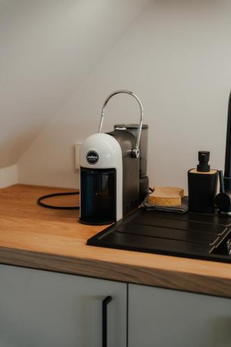 a toaster sitting on top of a kitchen counter at Good Home Apartment in Karksi-Nuia