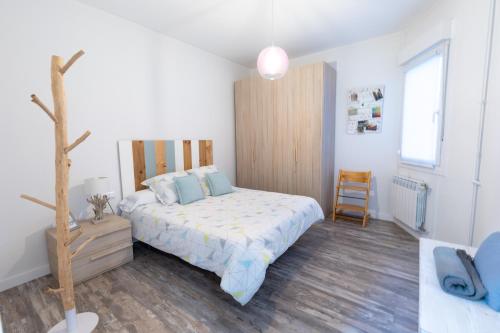Postel nebo postele na pokoji v ubytování Apartamento VI-VI (Vida en Vitoria)