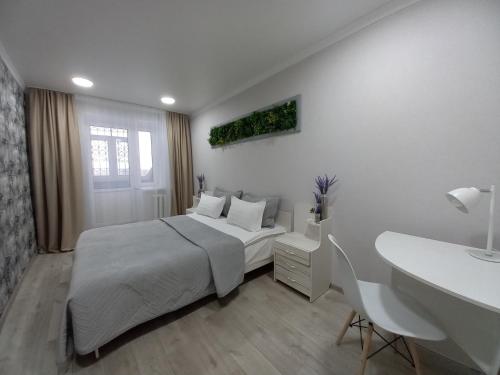 En eller flere senge i et værelse på Апартаменты в районе Космос