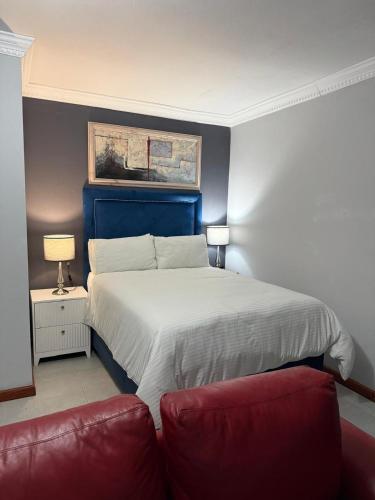 En eller flere senge i et værelse på The Palms Bed & Breakfast