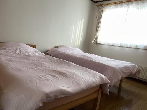 Giường trong phòng chung tại えとわーる