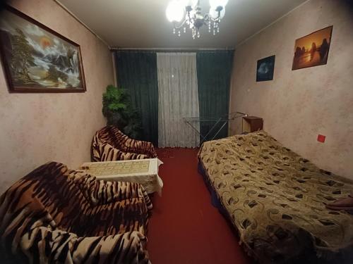 En eller flere senge i et værelse på Східний мікрорайон апартаменти