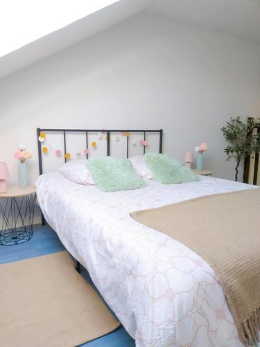 En eller flere senge i et værelse på Bulles de bonheur