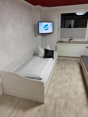 En eller flere senge i et værelse på Ihr Zuhause am Dom Stilvoll übernachten im Herzen von Halberstadt