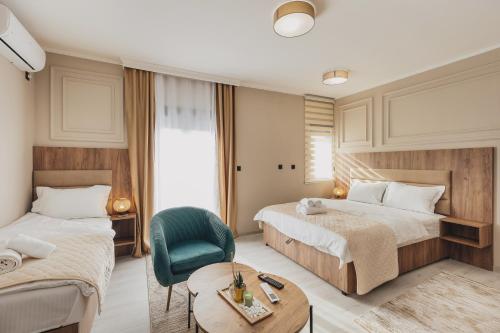 En eller flere senge i et værelse på LuxA