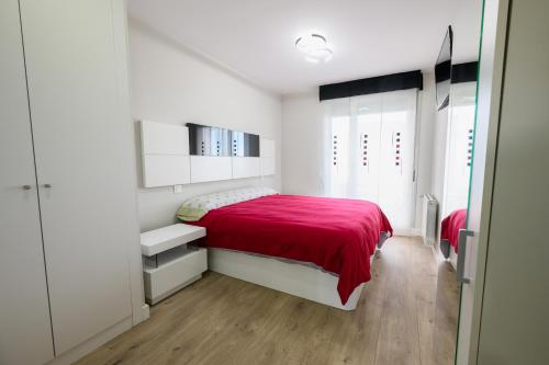 En eller flere senge i et værelse på Apartamento Cervantino