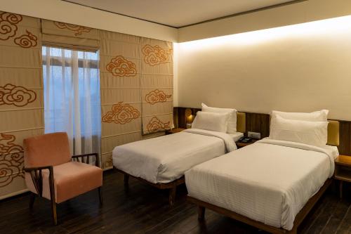 Postel nebo postele na pokoji v ubytování Pema Thang Guest House Mcleodganj