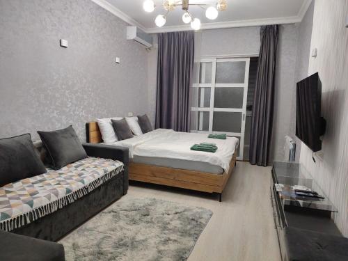 Et tv og/eller underholdning på Comfy and Cosy Apartment