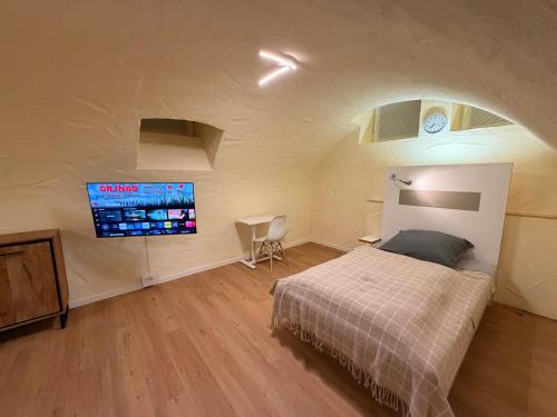 En eller flere senge i et værelse på Pension Elisa