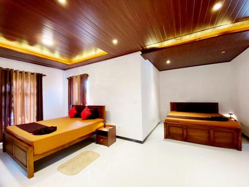 En eller flere senge i et værelse på Villa Black Boulder