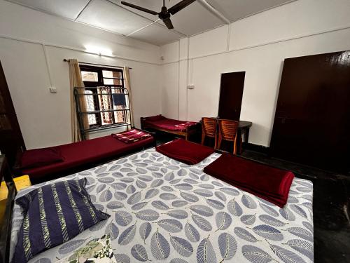 Giường trong phòng chung tại MG stay