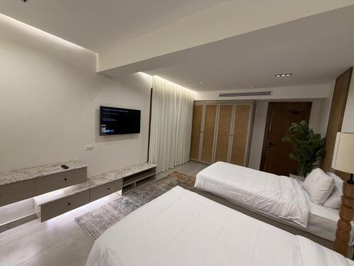 En eller flere senge i et værelse på Sunny Days Palma De Mirette Resort & Spa