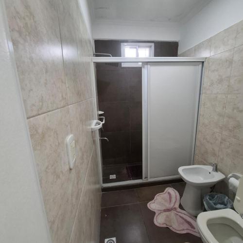a bathroom with a shower and a toilet at very spacious house equipped for 4 people in Resistencia
