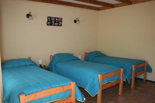 Cama o camas de una habitación en Hostal Km Zero El Huertillo