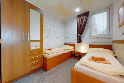 Postel nebo postele na pokoji v ubytování Apartmán Harmónia, Bardejovské kúpele