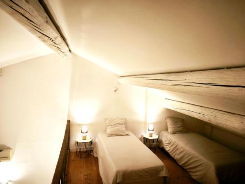 En eller flere senge i et værelse på Maison d'hôte Mas de Castille entre Uzès et le pont du Gard