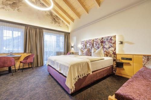 En eller flere senge i et værelse på Apparthotel Sonnenhof