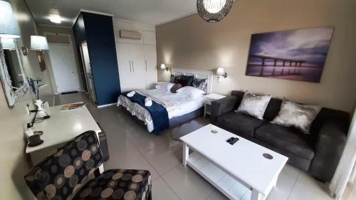 En eller flere senge i et værelse på Blue views at Brookes Hill Suites