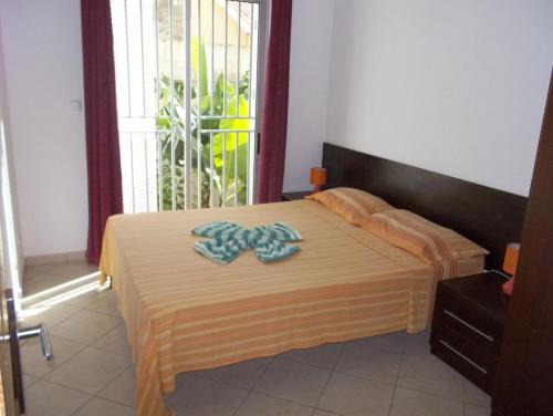 Postel nebo postele na pokoji v ubytování Basic Hotel