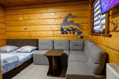 a living room with a couch and a table at Тіна in Slavske