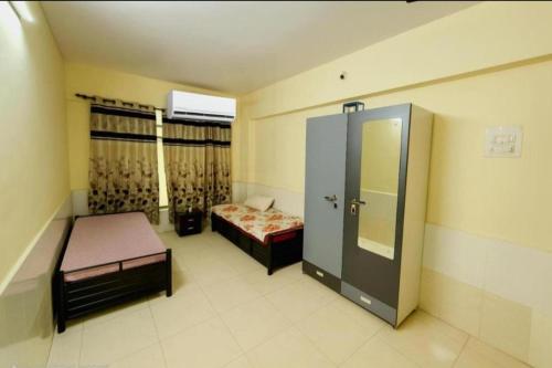 a room with a bedroom with a bed and a mirror at Luxurious Private Room in thane only for Male in Thane