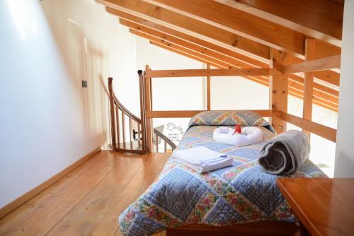 a bedroom with a bed with a pillow and books at Villa Nataly in Crosano