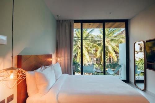 Postel nebo postele na pokoji v ubytování CALIXTA Hotel