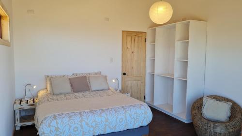 En eller flere senge i et værelse på MonteWave Cabaña