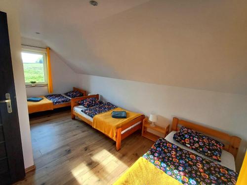 En eller flere senge i et værelse på Idzikowianka