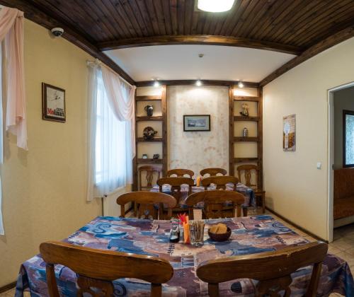 a dining room with a table and chairs at Leo in Daugavpils