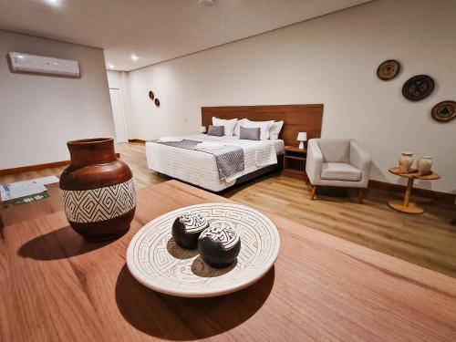 a bedroom with a bed and a table with two cookies at Amazon Seasons hotel in Belém