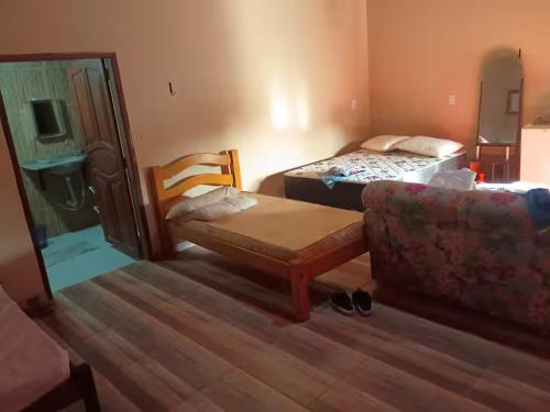 Giường trong phòng chung tại Petricor Casa de Temporada COP30