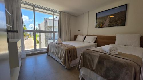 Postel nebo postele na pokoji v ubytování Casa Brisa Cond Naluum by ReservaMilagres