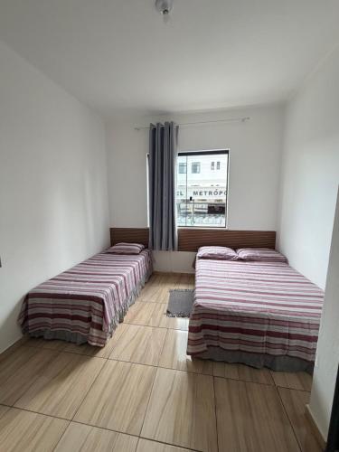 En eller flere senge i et værelse på Hotel Colombo