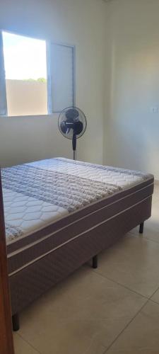 a close up of a bed in a room at Montebelle casa2 in Porangaba