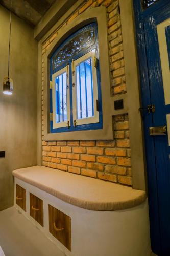a window in a room with a bench under it at Arcadian Weligama in Weligama