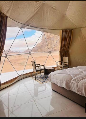 En eller flere senge i et værelse på Rum STAR LUXURY Camp &JEEP Tours