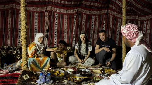 a group of people sitting in a room at Sama Al Sharqiyah Camp in Al Wāşil